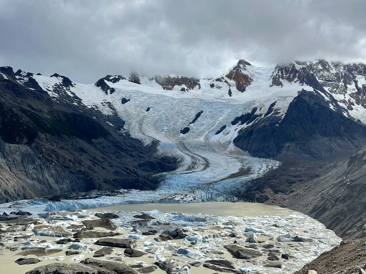 Icebergs floating in Laguna Torre below Grande Glacier, seen from Mirador Maestri on a cloudy day