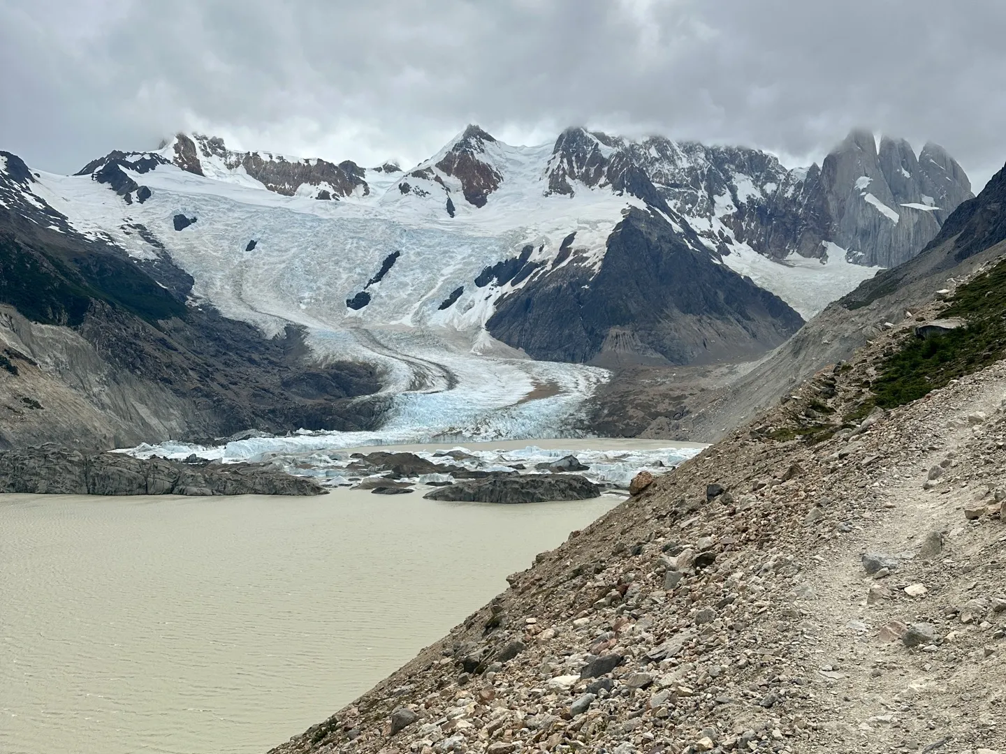The rocky moraine trail to Mirador Maestri above Laguna Torre, with the glacier and granite spires ahead