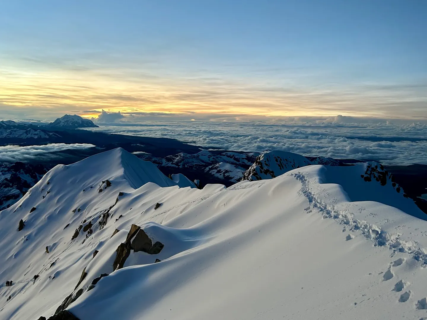 First light over a sea of cloud, seen from the snow ridge below the Huayna Potosi summit
