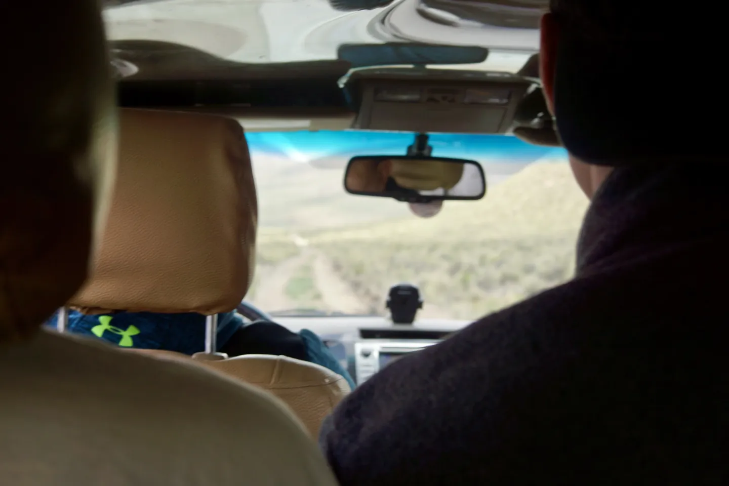View through the windscreen on the drive out of La Paz, a dirt road crossing the open altiplano