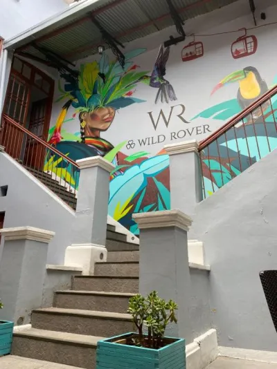 Painted mural and steps at the entrance to Wild Rover hostel in La Paz