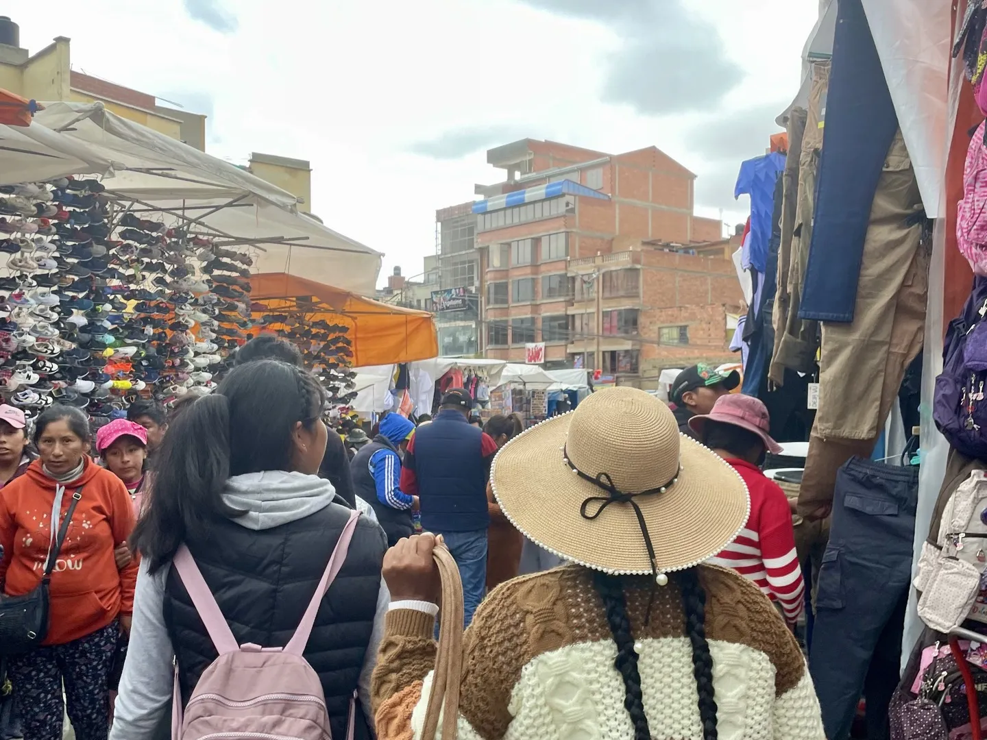 Shoppers moving through a crowded street market in La Paz, Bolivia