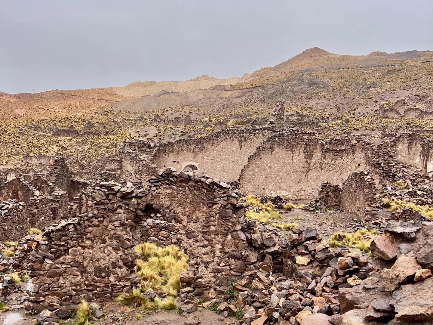 Crumbling stone walls of the Pueblo Fantasma ghost town on the road through Sud Lipez