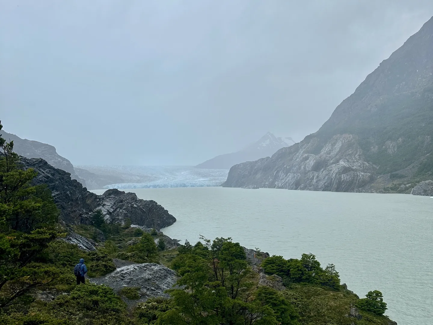 Grey Glacier under heavy cloud at the far end of Lago Grey, from the viewpoint past Refugio Grey