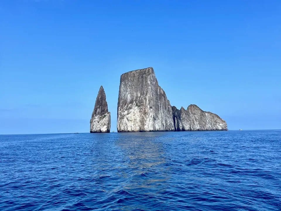 Kicker Rock, a tall split rock rising out of deep blue sea off San Cristóbal