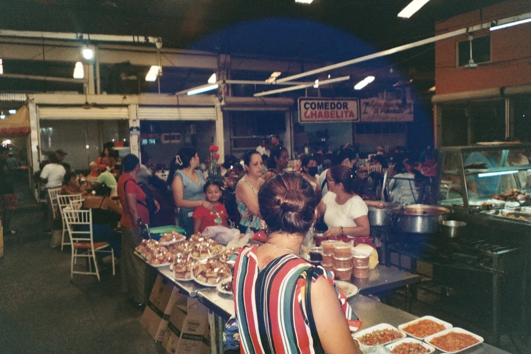 Indoor food market with warm tungsten lighting