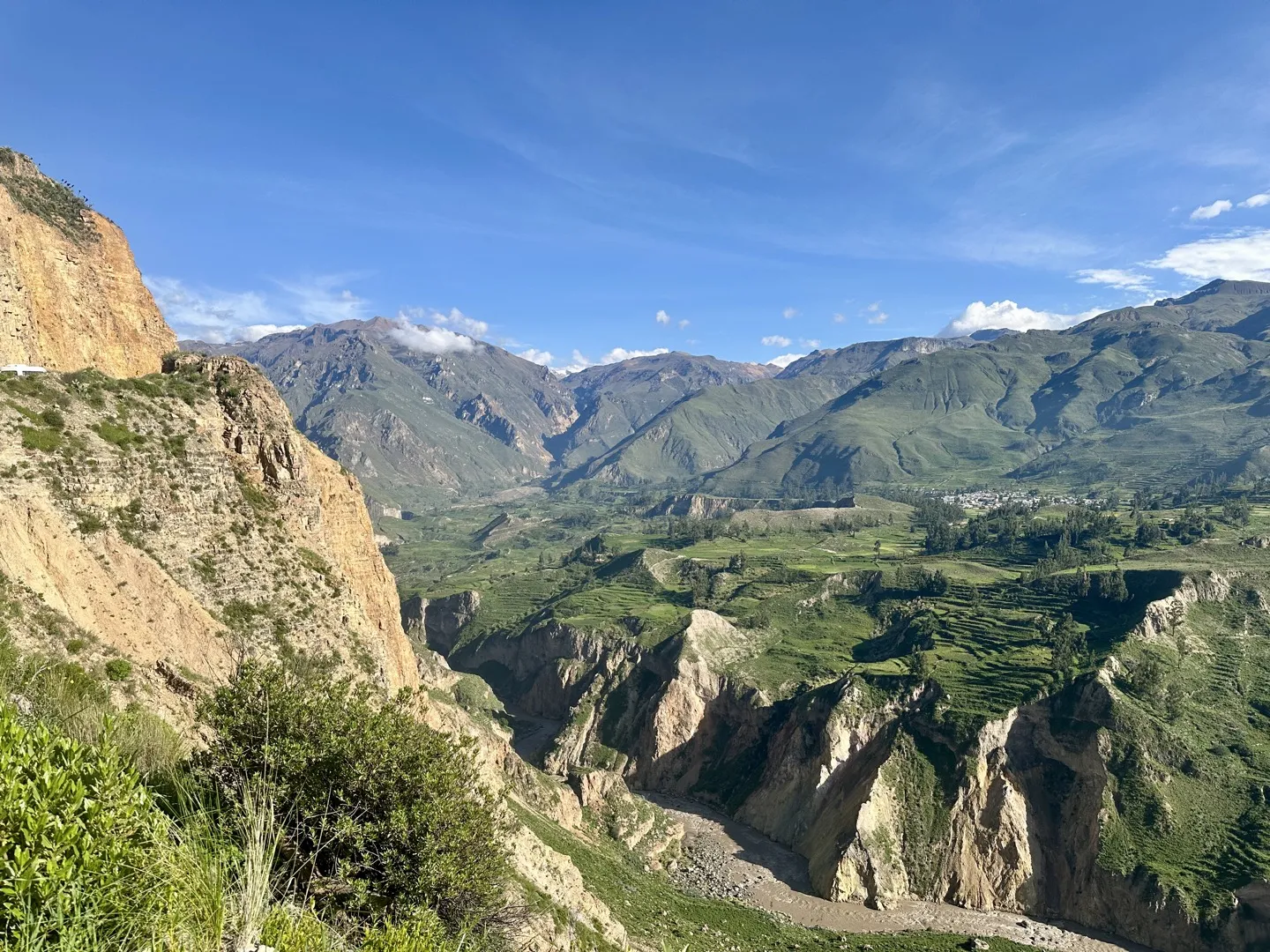 Viewpoint over the Colca Canyon with green terraced fields dropping into the valley