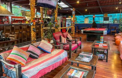 Colourful Andean-textile lounge and games area at Nativus Hostel Machu Picchu, Aguas Calientes